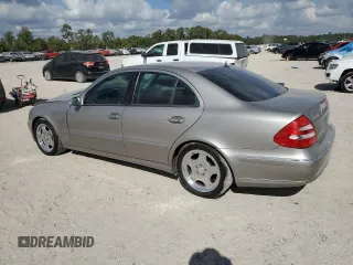 2003 Mercedes-Benz E-Class 5.0L with VIN WDBUF70J73A119596, listed as a Copart auction lot 77382424 with 237,620 mi miles and Salvage Title. Bid and sale history available at carsss.com. Image 2.
