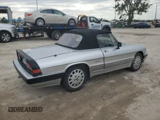 1990 Alfa Romeo Spider z VIN ZARBA12T0L6002373, wystawiony jako Copart lot #75362404 z przebiegiem 73 479 mil mil oraz Nie do naprawy • Non repairable. Historia ofert i sprzedaży dostępna na DreamBid. Obrazek 3.