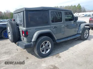 2018 Jeep Wrangler Unlimited Sahara z VIN 1C4HJXEN8JW329816, wystawiony jako IAAI lot #42055851 z przebiegiem 70 298 mil mil oraz . Historia ofert i sprzedaży dostępna na DreamBid. Obrazek 4.