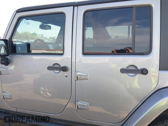 2015 Jeep Wrangler Unlimited Sahara with VIN 1C4BJWEG2FL558860, listed as a IAAI auction lot 41937360 with 113,627 mi miles. Bid and sale history available at carsss.com. Image 15.