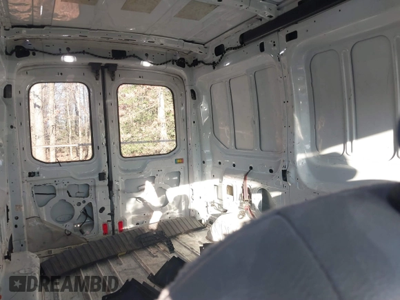 2019 Ford Transit with VIN 1FTYE1CM6KKA74930, listed as a IAAI auction lot 41020843 with 104,218 mi miles and . Bid and sale history available at DreamBid. Image 8.
