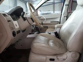 2008 Mercury Mariner Premier z VIN 4M2CU97118KJ52951, wystawiony jako Copart lot #61640225 z przebiegiem 186 109 mil mil oraz Szkoda całkowita • Salvage title. Historia ofert i sprzedaży dostępna na DreamBid. Obrazek 7.
