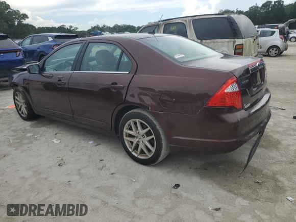 2012 Ford Fusion SEL z VIN 3FAHP0JA5CR184593, wystawiony jako Copart lot #61647265 z przebiegiem 127 720 mil mil oraz Szkoda całkowita • Salvage title. Historia ofert i sprzedaży dostępna na DreamBid. Obrazek 2.