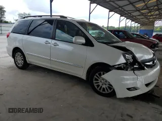 2010 Toyota Sienna XLE with VIN 5TDYK4CCXAS335064, listed as a Copart auction lot 62649665 with 246,327 mi miles and Salvage title. Bid and sale history available at DreamBid. Image 4.
