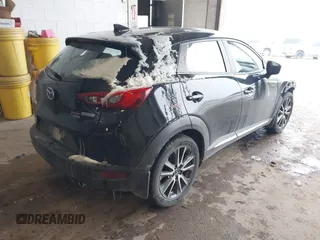 2016 Mazda CX-3 Grand Touring with VIN JM1DKFD71G0132801, listed as a IAAI auction lot 41573276 with 90,000 mi miles. Bid and sale history available at carsss.com. Image 4.