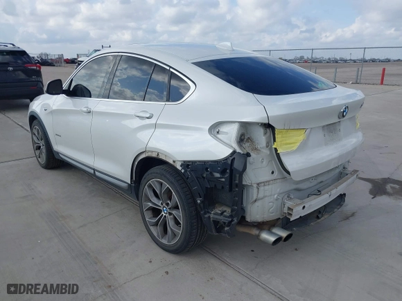 2015 BMW X4 xDrive28i with VIN 5UXXW3C53F0M88714, listed as a IAAI auction lot 41483692 with 132,054 mi miles. Bid and sale history available at carsss.com. Image 3.