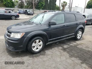 2013 Dodge Journey SE with VIN 3C4PDCAB7DT597063, listed as a Copart auction lot 55896734 with 140,847 mi miles and Clean Title. Bid and sale history available at carsss.com. Image 1.