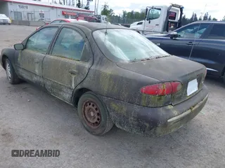 1995 Ford Contour z VIN 3FALP6633SM116313, wystawiony jako IAAI lot #42058920 z przebiegiem 192 905 mil mil oraz . Historia ofert i sprzedaży dostępna na DreamBid. Obrazek 3.