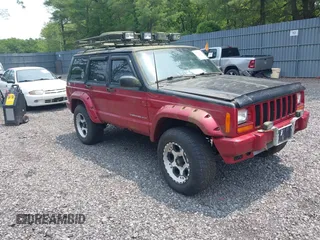 1999 Jeep Cherokee Sport z VIN 1J4FF68S2XL591291, wystawiony jako IAAI lot #42430037 z przebiegiem 329 792 mil mil oraz . Historia ofert i sprzedaży dostępna na DreamBid. Obrazek 1.