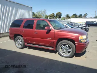 2002 GMC Yukon Denali z VIN 1GKEK63U02J118522, wystawiony jako Copart lot #52031995 z przebiegiem 166 332 mil mil oraz Szkoda całkowita • Salvage title. Historia ofert i sprzedaży dostępna na DreamBid. Obrazek 4.