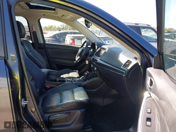 2016 Mazda CX-5 Grand Touring with VIN JM3KE2DY9G0824196, listed as a IAAI auction lot 41801887 with 88,625 mi miles. Bid and sale history available at carsss.com. Image 5.