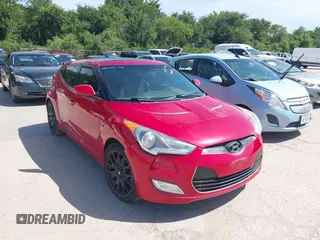 2013 Hyundai Veloster w/Black Int with VIN KMHTC6AD9DU135318, listed as a IAAI auction lot 42632212 with 97,485 mi miles and . Bid and sale history available at DreamBid. Image 1.