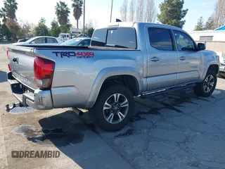 2018 Toyota Tacoma SR with VIN 3TMCZ5AN6JM185891, listed as a IAAI auction lot 41450665 with 53,749 mi miles and . Bid and sale history available at DreamBid. Image 4.