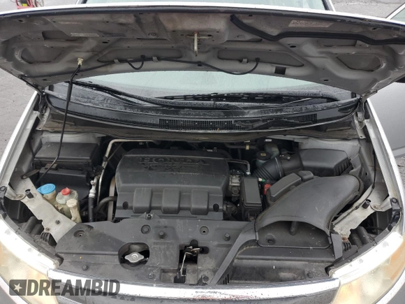 2011 Honda Odyssey Touring with VIN 5FNRL5H99BB021223, listed as a Copart auction lot 61171775 with 194,029 mi miles and Salvage title. Bid and sale history available at DreamBid. Image 12.