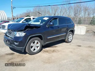 2011 Jeep Grand Cherokee Laredo with VIN 1J4RR4GG3BC670712, listed as a IAAI auction lot 41738127 with 93,714 mi miles and . Bid and sale history available at DreamBid. Image 17.