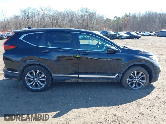 2020 Honda CR-V Touring with VIN 2HKRW2H98LH626651, listed as a IAAI auction lot 41668951 with 64,391 mi miles and . Bid and sale history available at DreamBid. Image 13.