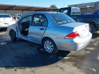 2006 Mitsubishi Lancer ES with VIN JA3AJ26E06U057959, listed as a IAAI auction lot 41347649 with 122,963 mi miles. Bid and sale history available at carsss.com. Image 3.