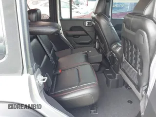 2021 Jeep Wrangler Unlimited Rubicon with VIN 1C4HJXFNXMW560512, listed as a IAAI auction lot 42124812 with 18,034 mi miles and . Bid and sale history available at DreamBid. Image 8.