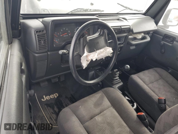 2003 Jeep Wrangler SE with VIN 1J4FA29113P351844, listed as a Copart auction lot 81411324 with 53,525 mi miles and Salvage title. Bid and sale history available at DreamBid. Image 8.