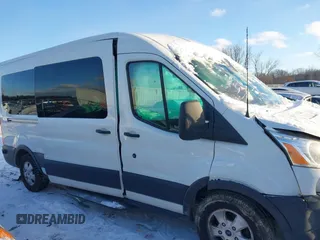 2018 Ford Transit Passenger XL z VIN 1FBAX2CM1JKA97858, wystawiony jako IAAI lot #41285058 z przebiegiem 252 805 mil mil oraz . Historia ofert i sprzedaży dostępna na DreamBid. Obrazek 13.