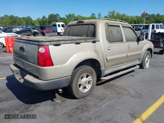 2004 Ford Explorer Sport Trac XLS with VIN 1FMZU67K24UA66100, listed as a IAAI auction lot 42035953 with 217,105 mi miles. Bid and sale history available at carsss.com. Image 4.