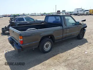 1992 Mitsubishi Mighty Max z VIN JA7FL24W9NP021503, wystawiony jako IAAI lot #41942559 z przebiegiem 162 088 mil mil oraz . Historia ofert i sprzedaży dostępna na DreamBid. Obrazek 4.