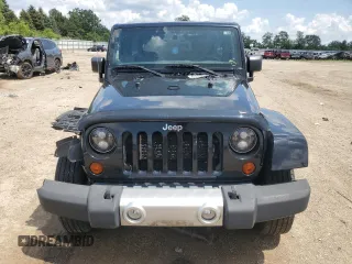 2012 Jeep Wrangler Unlimited Sahara z VIN 1C4HJWEG6CL141988, wystawiony jako Copart lot #61631115 z przebiegiem 140 401 mil mil oraz Szkoda całkowita • Salvage title. Historia ofert i sprzedaży dostępna na DreamBid. Obrazek 5.