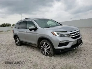 2017 Honda Pilot Touring z VIN 5FNYF6H92HB006855, wystawiony jako Copart lot #53650655 z przebiegiem 130 732 mil mil oraz Szkoda całkowita • Salvage title. Historia ofert i sprzedaży dostępna na DreamBid. Obrazek 14.