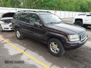 2004 Jeep Grand Cherokee Laredo z VIN 1J4GW48SX4C106139, wystawiony jako IAAI lot #42254093 z przebiegiem 167 213 mil mil oraz . Historia ofert i sprzedaży dostępna na DreamBid. Obrazek 1.