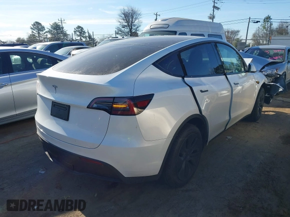 2025 Tesla Model Y Long Range with VIN 7SAYGDED9SA342374, listed as a IAAI auction lot 41663085 with 4,115 mi miles and . Bid and sale history available at DreamBid. Image 4.