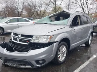 2016 Dodge Journey SXT with VIN 3C4PDDBG7GT173158, listed as a IAAI auction lot 42020182 with 159,136 mi miles. Bid and sale history available at carsss.com. Image 2.
