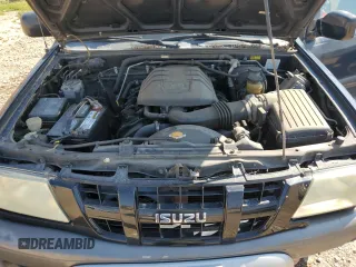 2003 Isuzu Rodeo with VIN 4S2CK58W634313617, listed as a Copart auction lot 70144664 with 179,921 mi miles and Clean Title. Bid and sale history available at DreamBid. Image 12.