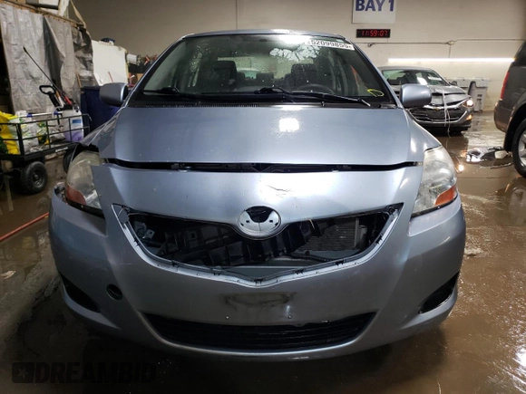 2010 Toyota Yaris with VIN JTDBT4K35A4064446, listed as a Copart auction lot 52099855 with 61,934 mi miles and Salvage Title. Bid and sale history available at carsss.com. Image 5.