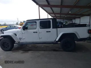 2021 Jeep Gladiator Willys with VIN 1C6HJTAG0ML505674, listed as a IAAI auction lot 42249317 with 60,150 mi miles and . Bid and sale history available at DreamBid. Image 14.