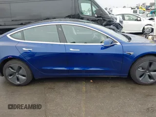 2020 Tesla Model 3 Standard Range Plus with VIN 5YJ3E1EAXLF644679, listed as a IAAI auction lot 41500595 with 53,726 mi miles and . Bid and sale history available at DreamBid. Image 13.