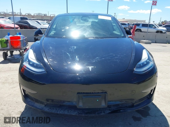 2019 Tesla Model 3 Mid Range with VIN 5YJ3E1EA3KF325056, listed as a IAAI auction lot 41771543 with 183,157 mi miles and . Bid and sale history available at carsss.com. Image 12.