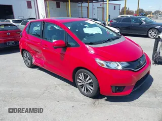 2015 Honda Fit EX-L z VIN 3HGGK5H86FM701066, wystawiony jako IAAI lot #41968611 z przebiegiem 126 671 mil mil oraz . Historia ofert i sprzedaży dostępna na DreamBid. Obrazek 1.