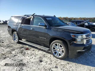 2019 Chevrolet Suburban Premier with VIN 1GNSKJKJXKR323704, listed as a Copart auction lot 72757214 with 150,404 mi miles and Salvage Title. Bid and sale history available at DreamBid. Image 4.