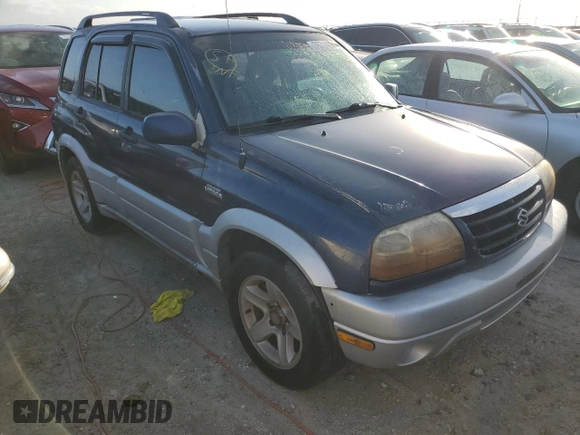 2003 Suzuki Grand Vitara z VIN JS3TE62V534100751, wystawiony jako Copart lot #76714894 z przebiegiem Nie podano mil oraz Nie do naprawy • Non repairable. Historia ofert i sprzedaży dostępna na DreamBid. Obrazek 4.