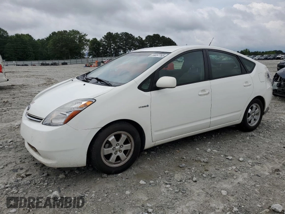 2006 Toyota Prius z VIN JTDKB20U867527026, wystawiony jako Copart lot #59057765 z przebiegiem 248 523 mil mil oraz Nie do naprawy • Non repairable. Historia ofert i sprzedaży dostępna na DreamBid. Obrazek 1.