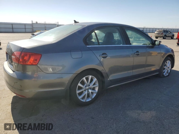 2014 Volkswagen Jetta SE with VIN 3VWD07AJXEM315231, listed as a Copart auction lot 58258075 with 99,860 mi miles and Salvage title. Bid and sale history available at DreamBid. Image 3.