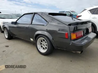 1985 Toyota Supra z VIN JT2MA67L3F0151708, wystawiony jako Copart lot #74672844 z przebiegiem 60 346 mil mil oraz Szkoda całkowita • Salvage title. Historia ofert i sprzedaży dostępna na DreamBid. Obrazek 2.