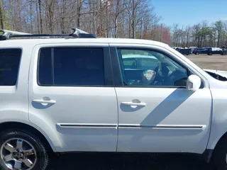 2011 Honda Pilot Touring with VIN 5FNYF4H96BB014095, listed as a IAAI auction lot 41794052 with 202,440 mi miles and . Bid and sale history available at DreamBid. Image 13.