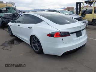2021 Tesla Model S Long Range with VIN 5YJSA1E57MF453815, listed as a IAAI auction lot 41818700 with 51,176 mi miles and . Bid and sale history available at DreamBid. Image 3.