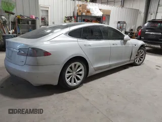 2017 Tesla Model S 100D with VIN 5YJSA1E23HF232059, listed as a IAAI auction lot 41394046 with 84,052 mi miles and . Bid and sale history available at DreamBid. Image 4.