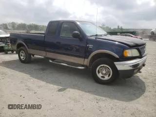 2002 Ford F-150 XL z VIN 1FTRX18L12NB86774, wystawiony jako Copart lot #59634165 z przebiegiem 262 567 mil mil oraz Szkoda całkowita • Salvage title. Historia ofert i sprzedaży dostępna na DreamBid. Obrazek 4.