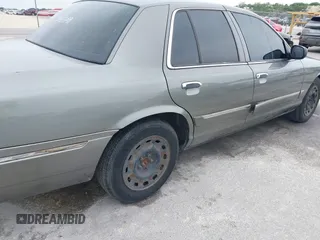 2003 Mercury Grand Marquis GS Convenience z VIN 2MEFM74W83X678151, wystawiony jako IAAI lot #42393410 z przebiegiem 273 966 mil mil oraz . Historia ofert i sprzedaży dostępna na DreamBid. Obrazek 15.
