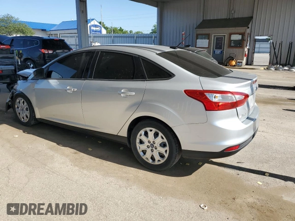 2012 Ford Focus SE with VIN 1FAHP3F29CL161559, listed as a Copart auction lot 61695575 with 127,412 mi miles and Salvage title. Bid and sale history available at DreamBid. Image 2.