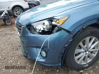 2016 Mazda CX-5 Touring z VIN JM3KE2CY3G0728968, wystawiony jako IAAI lot #42189174 z przebiegiem 145 977 mil mil oraz . Historia ofert i sprzedaży dostępna na DreamBid. Obrazek 6.