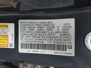 2023 Honda Civic Sedan LX with VIN 2HGFE2F29PH553494, listed as a IAAI auction lot 41895737 with 52,585 mi miles. Bid and sale history available at carsss.com. Image 9.